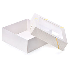 A luxurious box for maamoul and sweets with a transparent lid and golden decoration